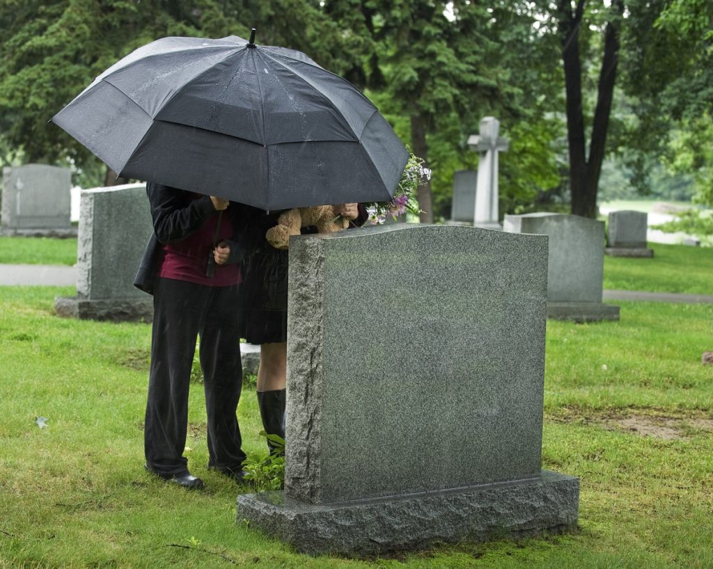 Family visiting the grave