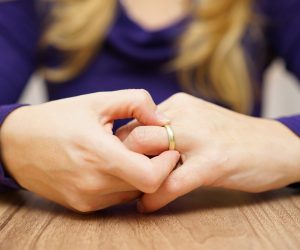 Woman removing wedding ring