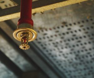 close up picture of a sprinkler inside a building