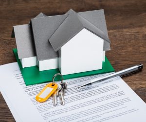 House Model With Keys And Ballpen On Contract Paper