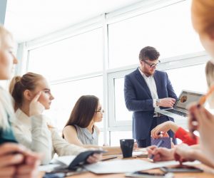 man presenting in a meeting