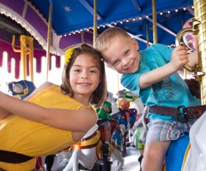 Kids riding a carousel