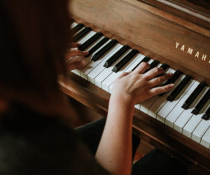 woman playing the piano