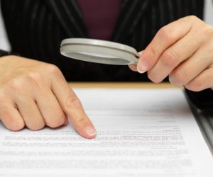 person examining a document