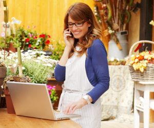 flower shop owner making calls