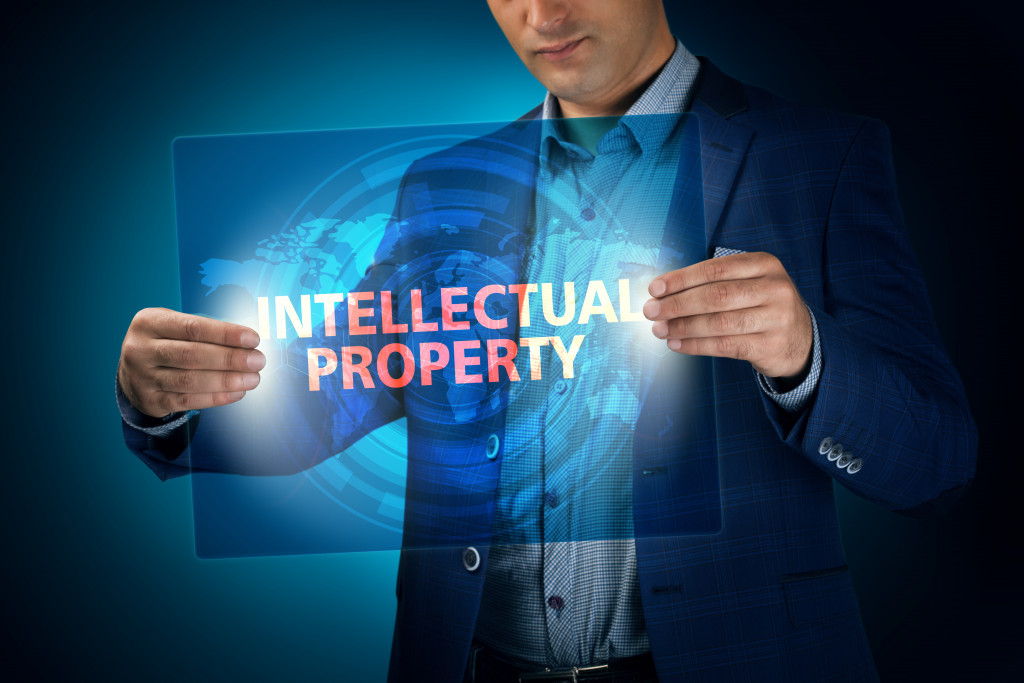 man holding intellectual property graphic